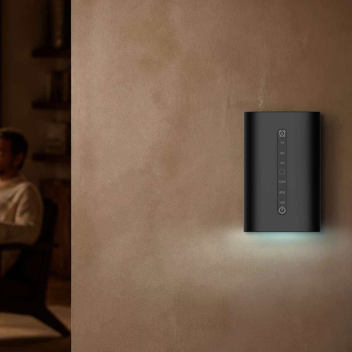 Waterless Diffuser MINI plugged into a living room wall, cyan ambient light glowing beneath the unit in a warm neutral interior