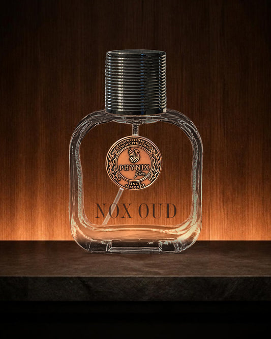 NOX OUD 50 mL Parfum by Phynix Fire Studios — clear glass bottle with copper coin seal, dark slatted wood with a low amber light