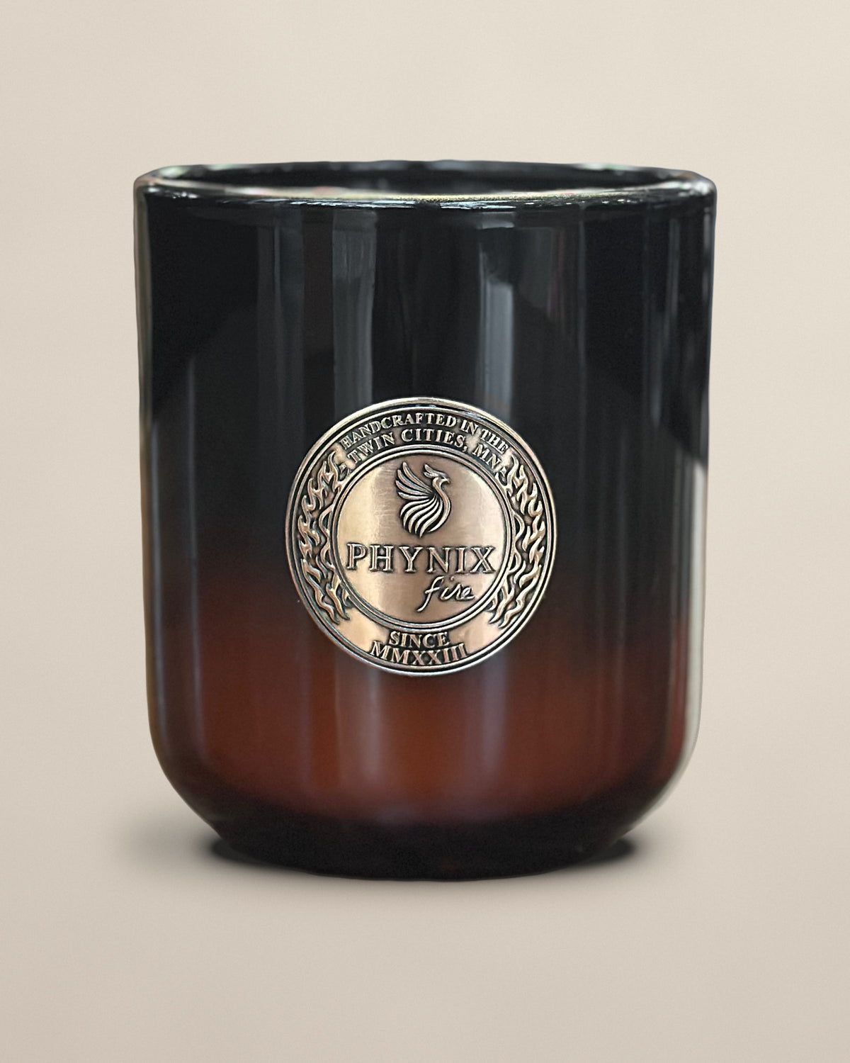 PARVUS 8 oz candle in black-to-amber glass with copper medallion