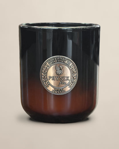 PARVUS 8 oz candle in black-to-amber glass with copper medallion