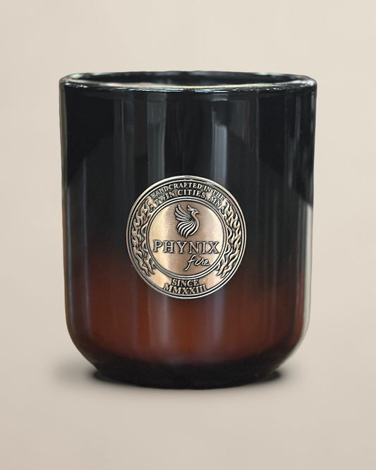 PARVUS 8 oz candle in black-to-amber glass with copper medallion